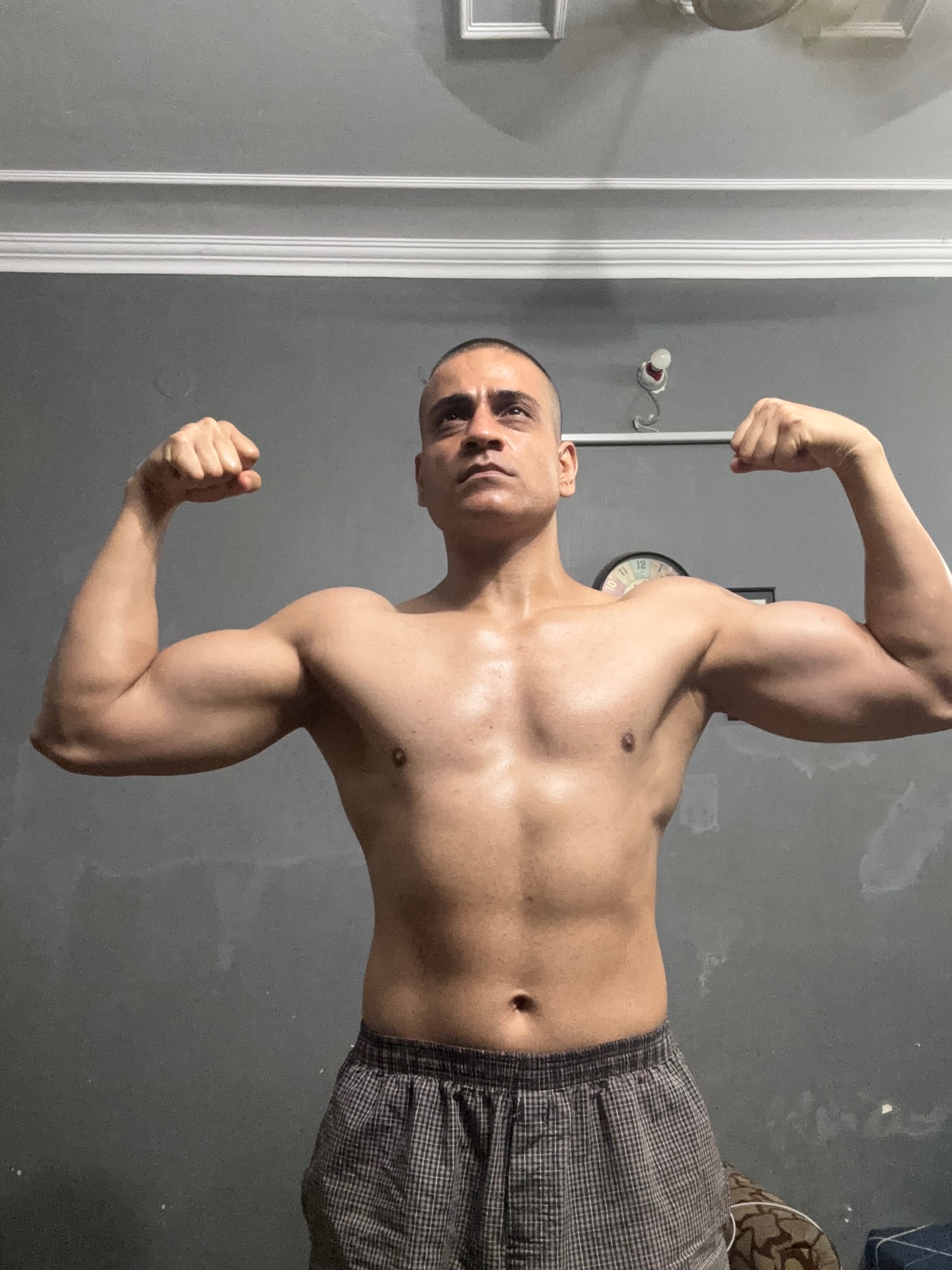 Shiva Malhotra ACE certified personal trainer demonstrating muscle mass and body composition built naturally after 40 through strength training and evidence-based lifestyle habits